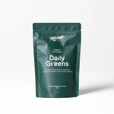 A Supplement container with the name Daily Greens by Mitchell's Nutrition.